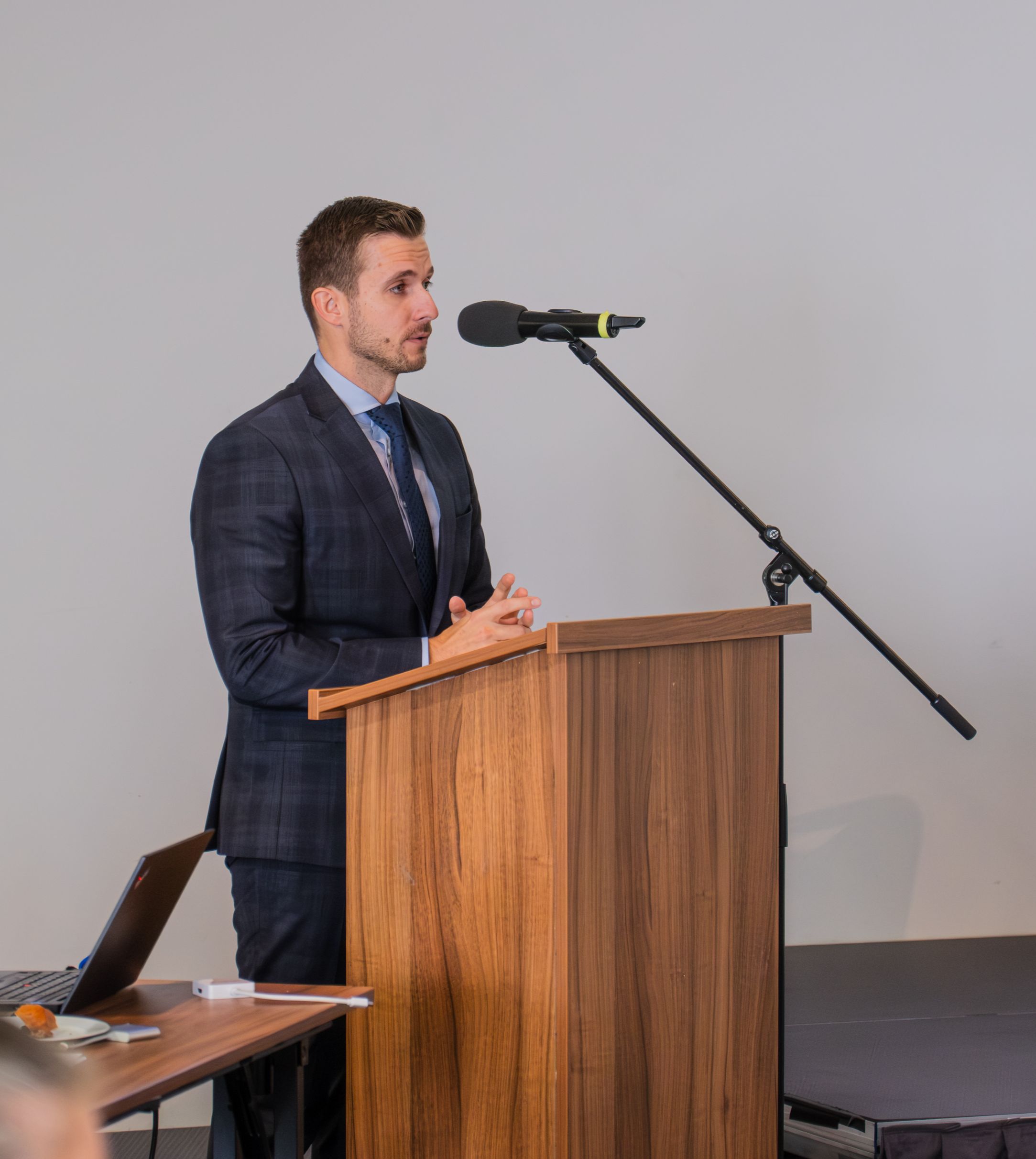 State Secretary Ján Hrinko speaking at a lectern